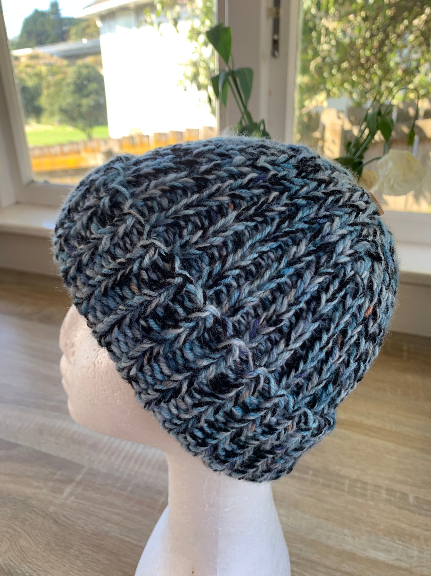 A ‘Born in 2022’ Toddler to Teen knit hat - black/blue/peach marled