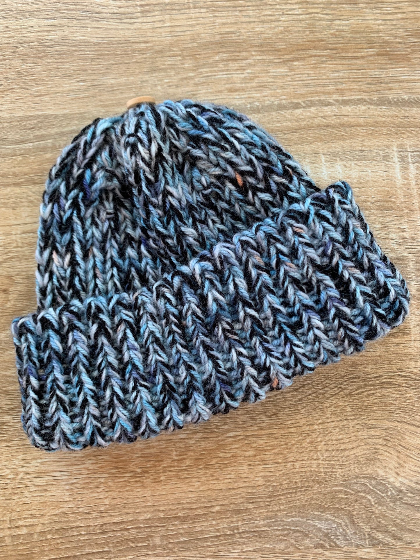 A ‘Born in 2022’ Toddler to Teen knit hat - black/blue/peach marled