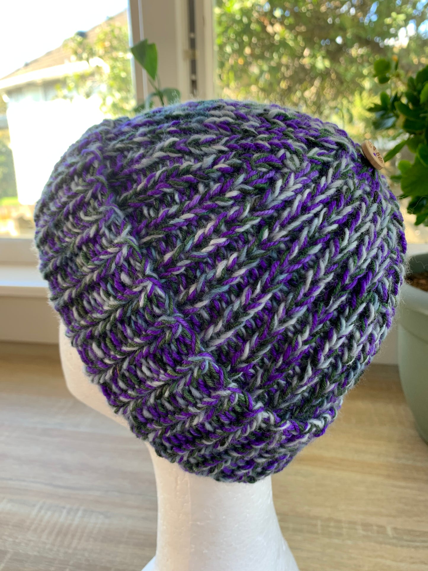 A ‘Born in 2022’ Toddler to Teen knit hat - purple/green/blue marled